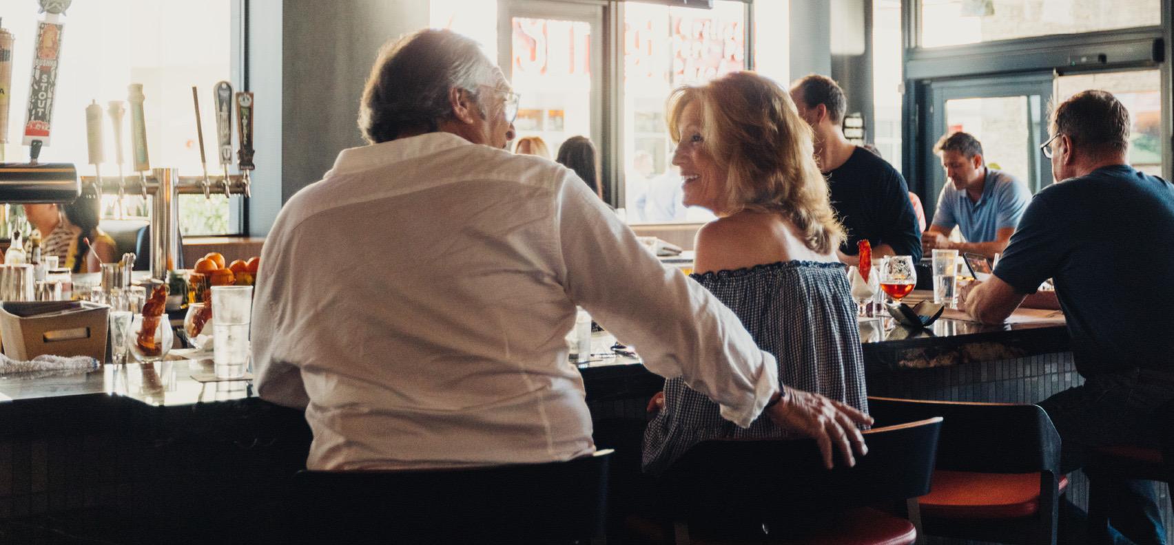 Couple sitting at bar